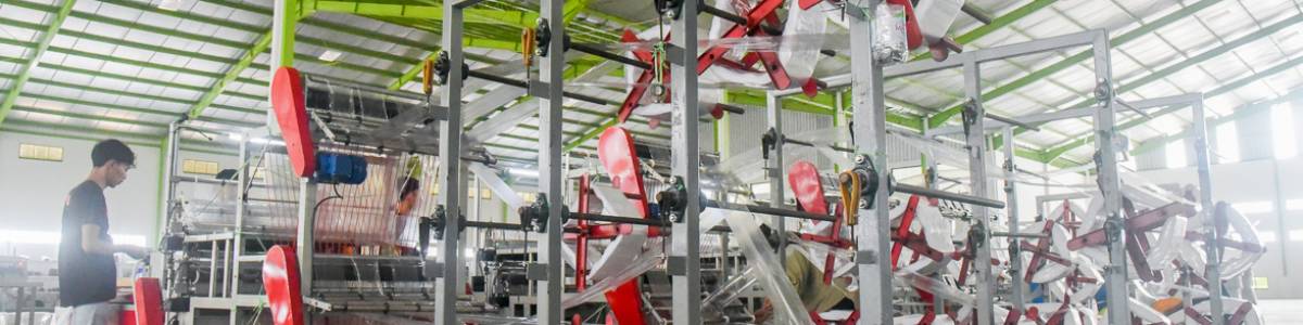 Heavy machinery in a plastic manufacturing factory in Indonesia